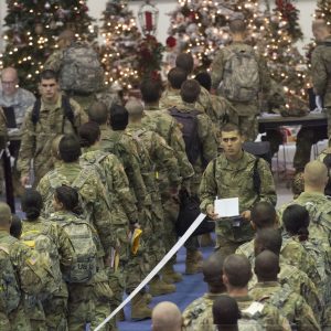 Trainees stand in line for processing at the Solomon Center on Fort Jackson Dec. 18 as he prepares to depart on Victory Block Leave. Rougly 6,000 trainees from Fort Jackson will be traveling home for the holidays before coming back to their post to continue training.